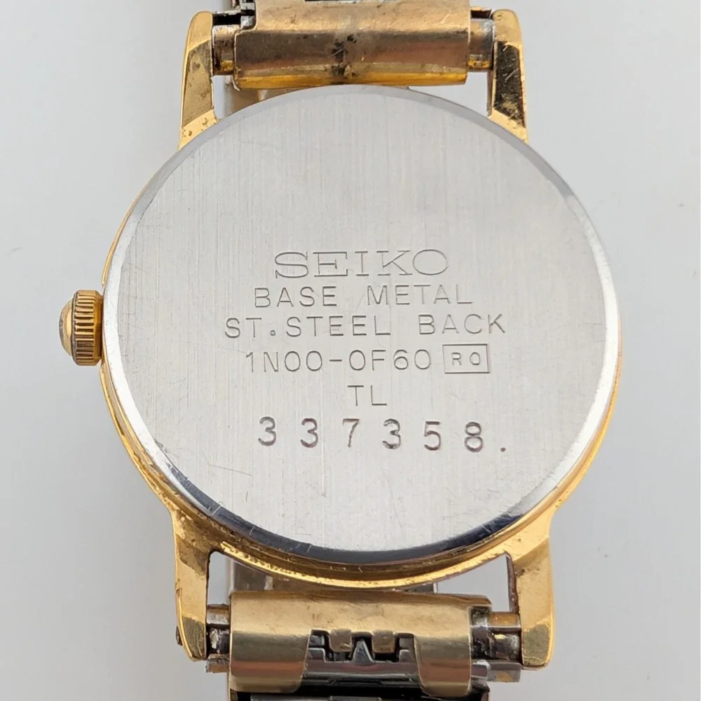 Vintage Seiko 1N00-0F60 Blue Woven Grid Textured Dial Gold Tone Watch 20mm